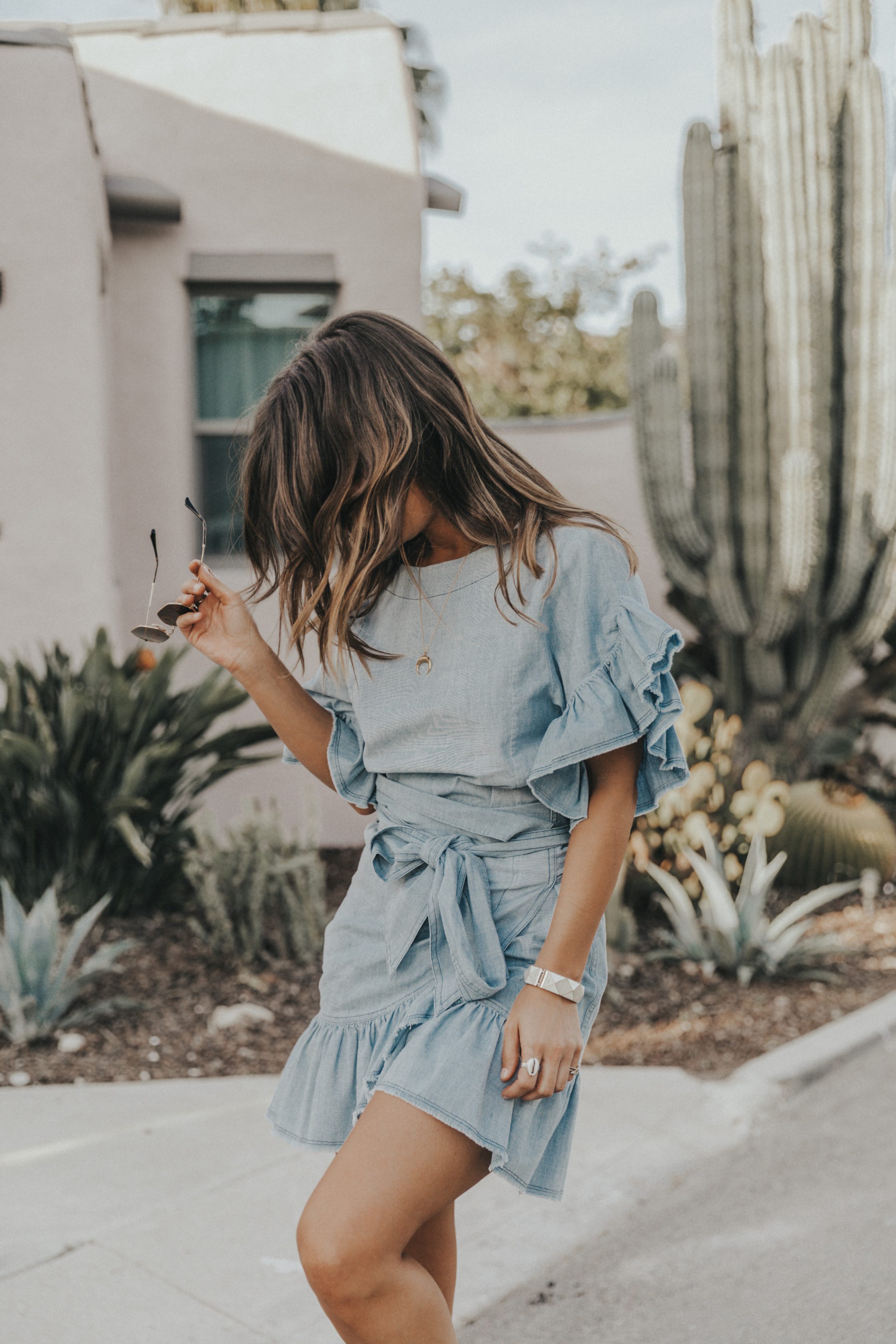 Sara of Collage Vintage wearing a Isabel Marant ruffled denim dress