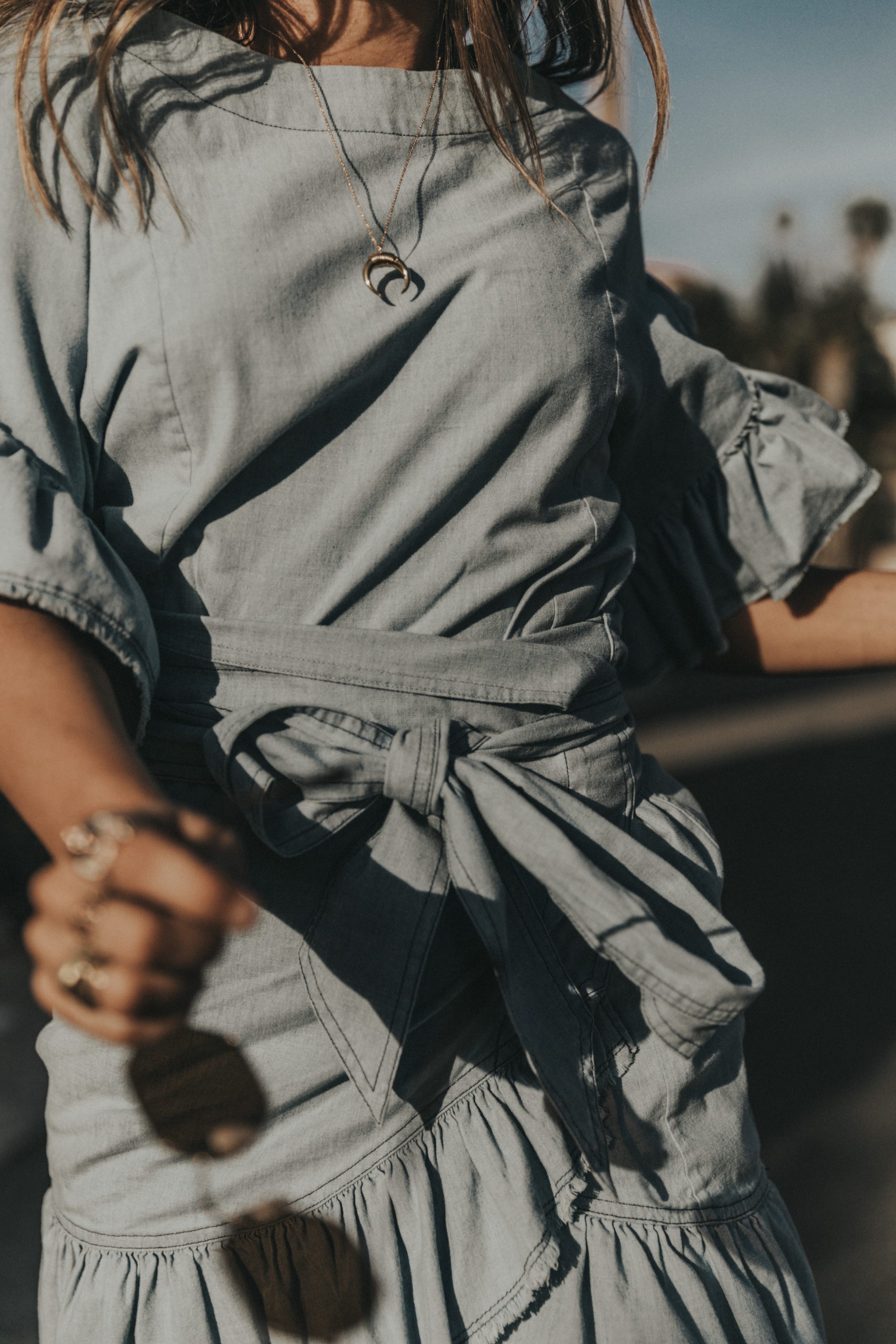 Sara of Collage Vintage wearing a Isabel Marant ruffled denim dress