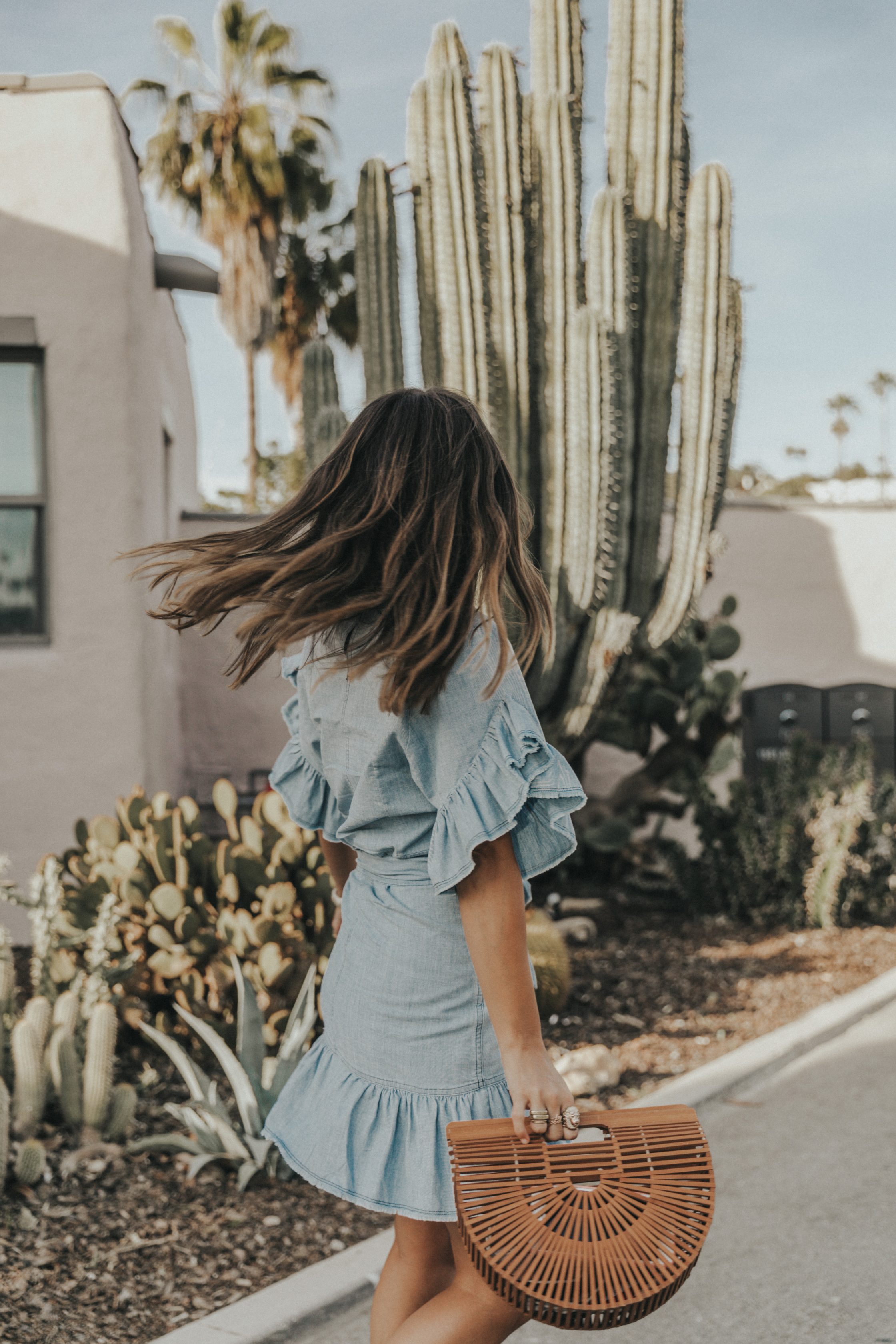 Sara of Collage Vintage wearing a Isabel Marant ruffled denim dress